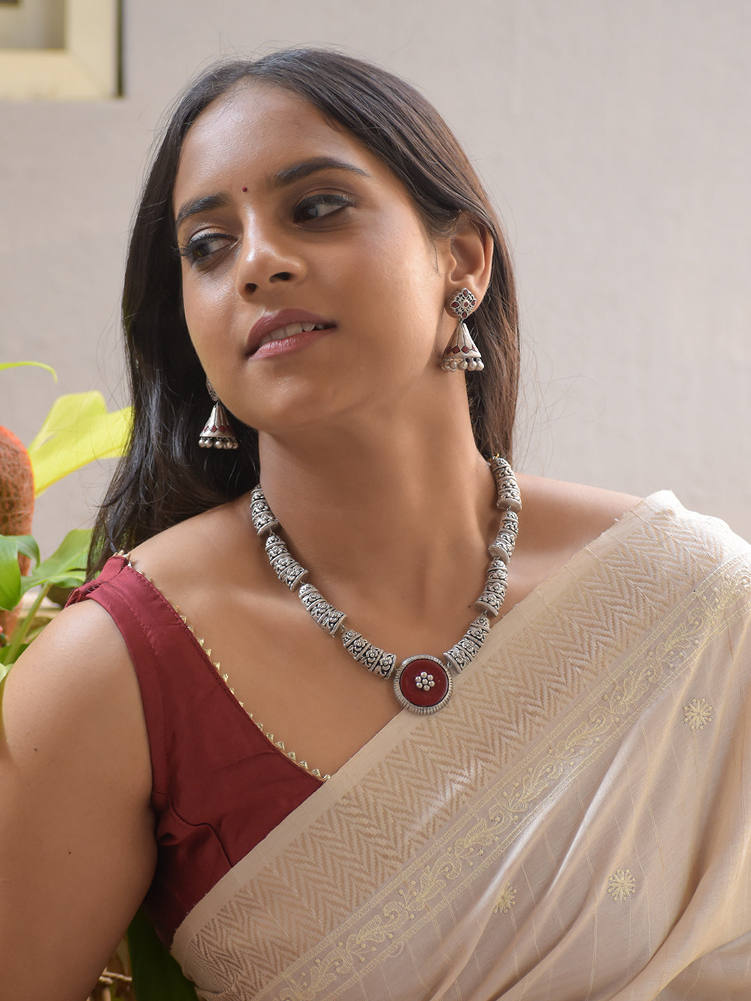 Suhasini - Handcrafted Antique Gold Terracotta Necklace Set with Brown Floral Centerpiece and Matching Earrings
