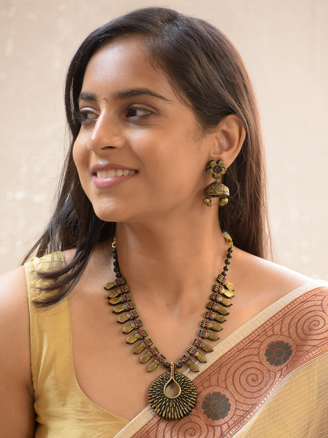 Handcrafted Antique Brass Tribal Necklace Set with Teardrop Pendant and Floral Jhumkas