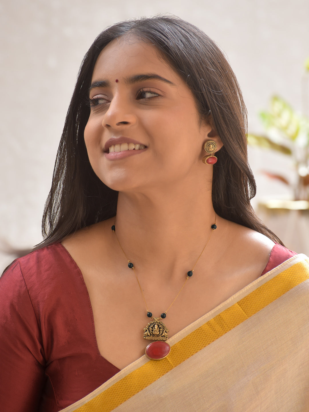 Terracotta Lakshmi Temple Pendant Necklace Set with Black Beads and Ruby Accents