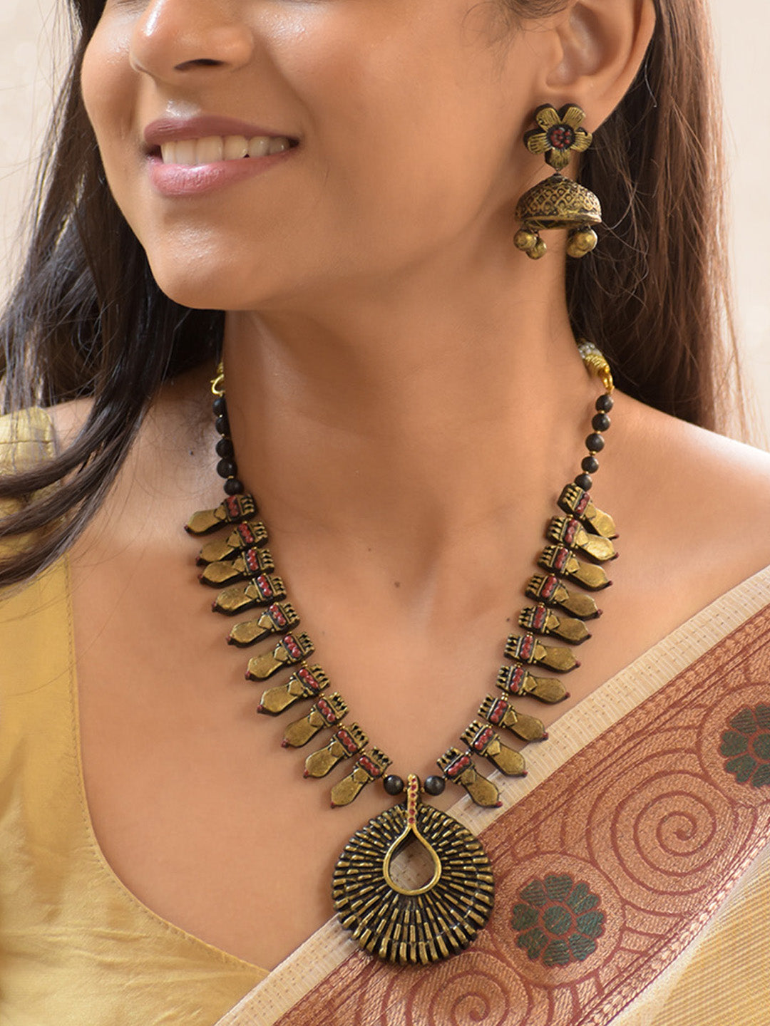 Handcrafted Antique Brass Tribal Necklace Set with Teardrop Pendant and Floral Jhumkas