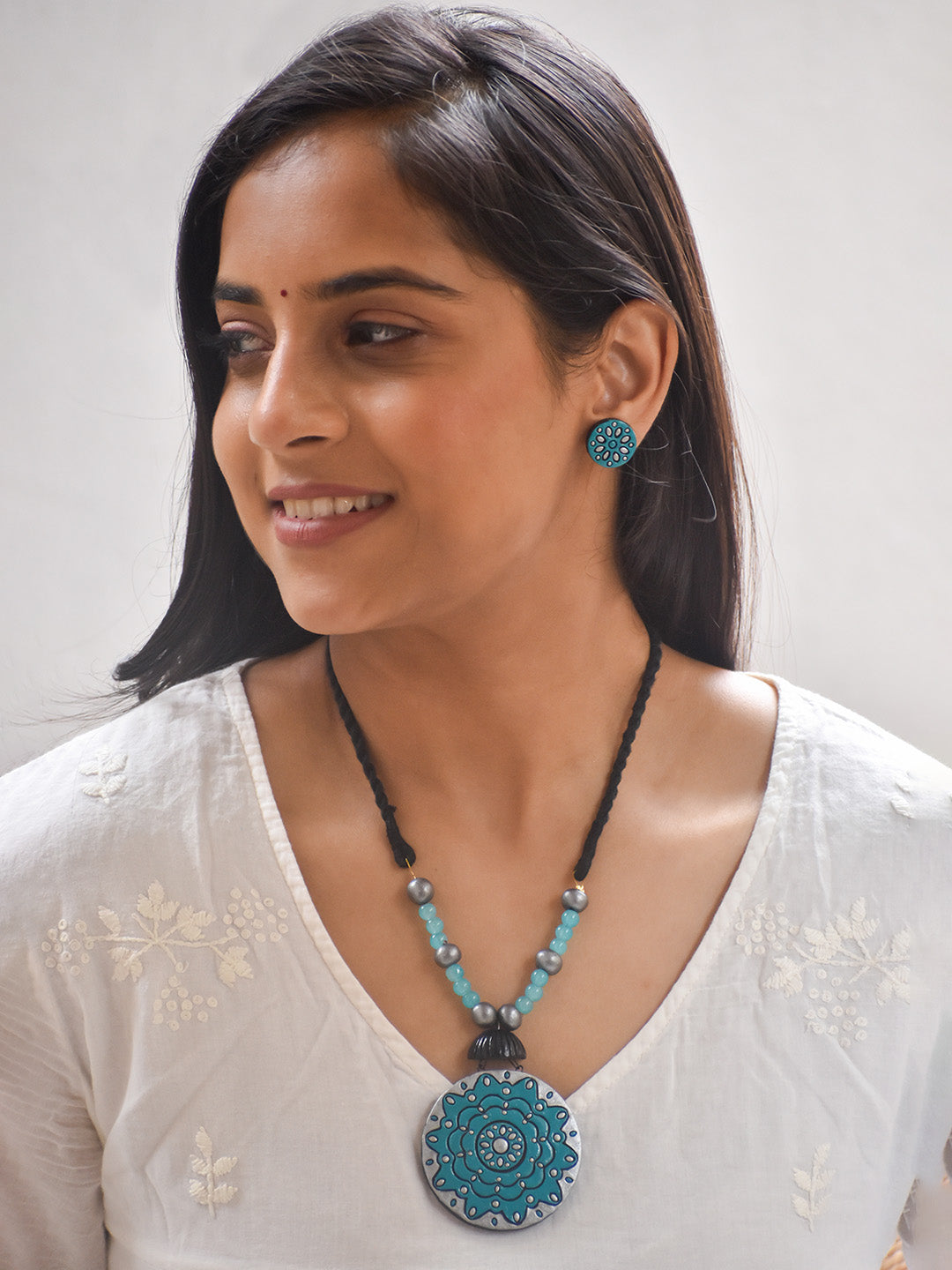 Handcrafted Terracotta Medallion Necklace Set with Blue Floral Design and Matching Studs