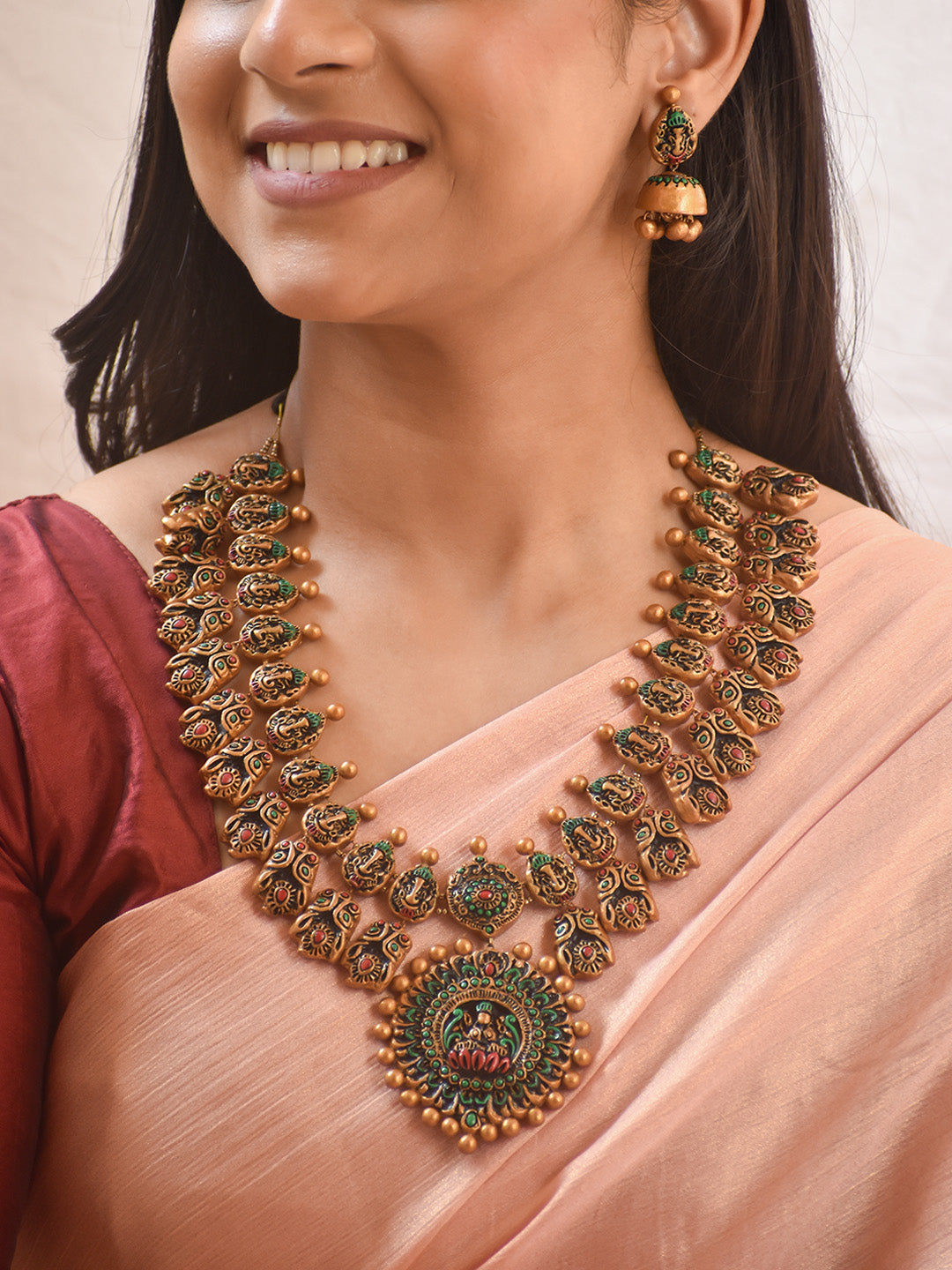 Handcrafted Ganesha Motif Lakshmi Pendant Terracotta Jewellery Set in Antique Gold, Green & Red