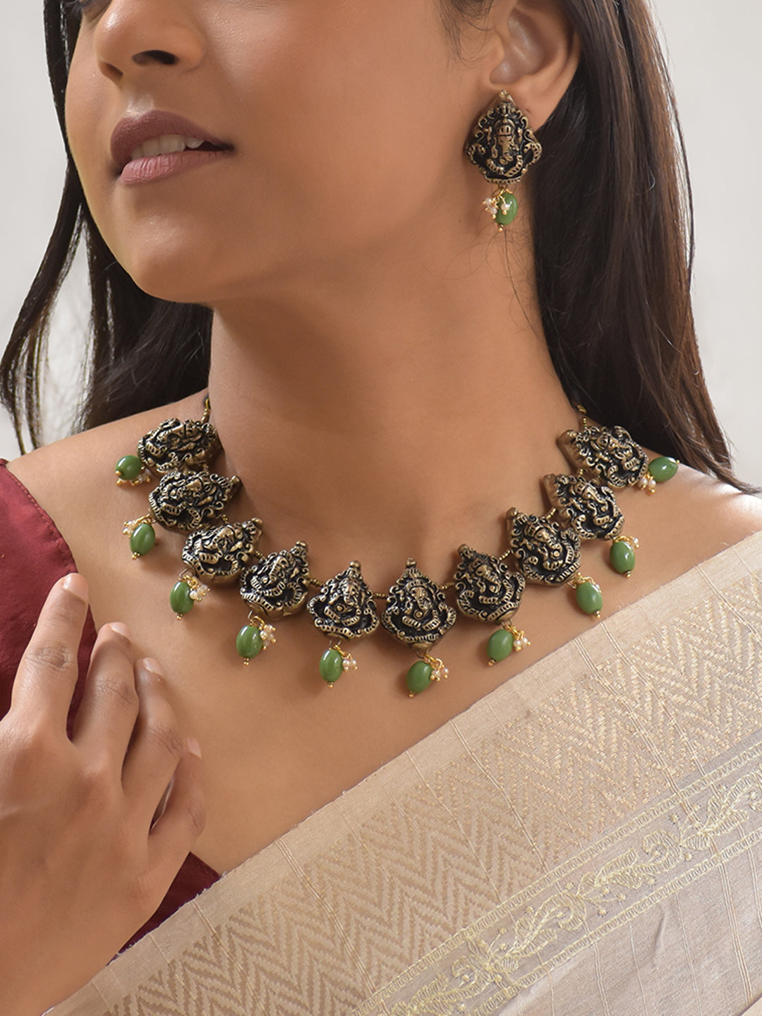 Handcrafted Terracotta Ganesha Necklace Set with Antique Gold Finish, Green Beads, and Matching Earrings