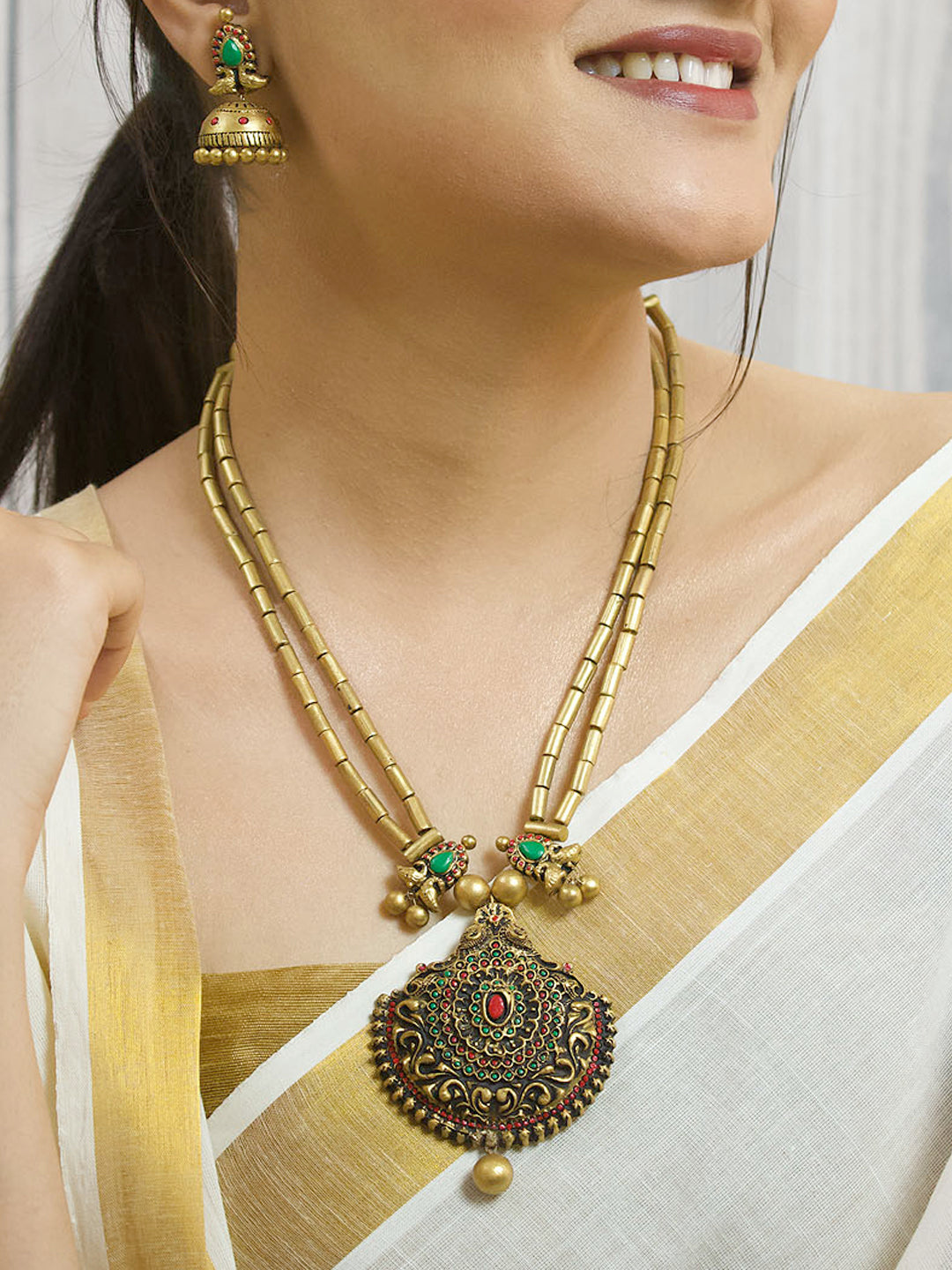 Dvimayura — Antique Gold Toned Peacock Design Pendant Two Layered Cylindrical Shape Beads Terracotta Necklace Set