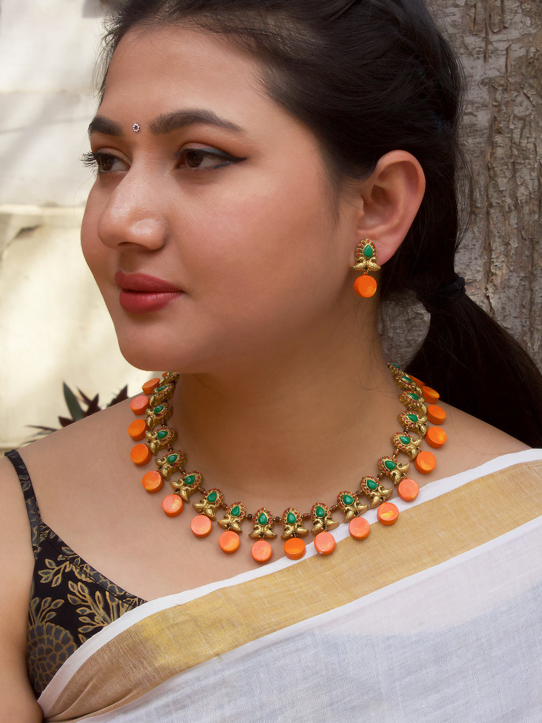 Antique Gold Toned Circular Shape Peacock Design Motifs Red And Green Color Terracotta Choker Necklace Set