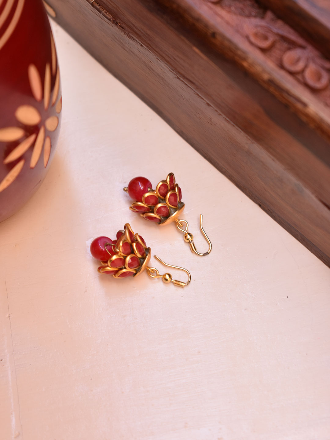 Avismaya Gold Plated Two Layered Tear Drop Design Maroon Color Studded Stones With Hanging Bead Jhumka Earring