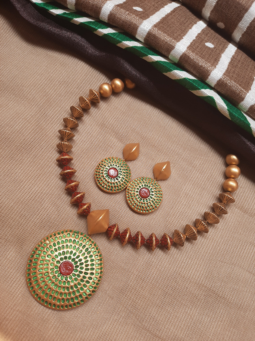 Antique Gold Toned Circular Shape Pendant Brown And Green Color Terracotta Choker Necklace Set
