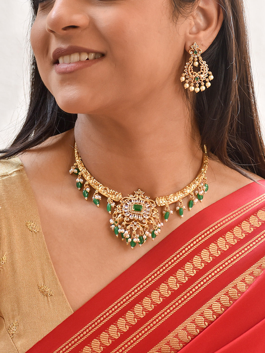 Celebrity Diva - Handcrafted Gold Finish Temple Hasli Necklace Set in Green & Pearl Accents