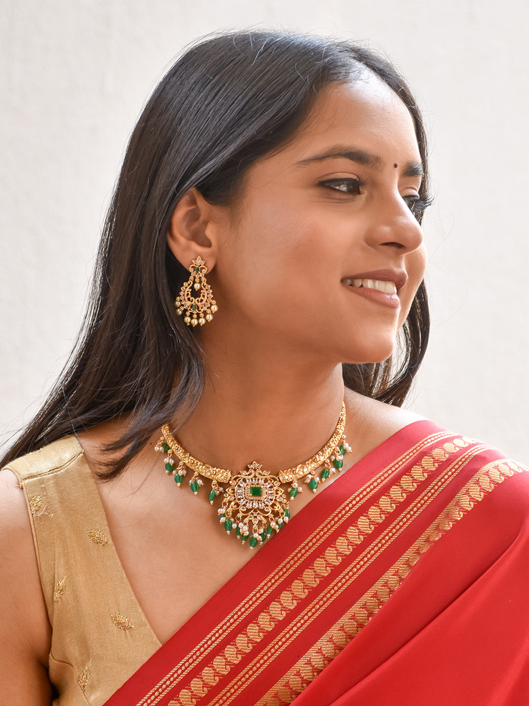 Celebrity Diva - Handcrafted Gold Finish Temple Hasli Necklace Set in Green & Pearl Accents