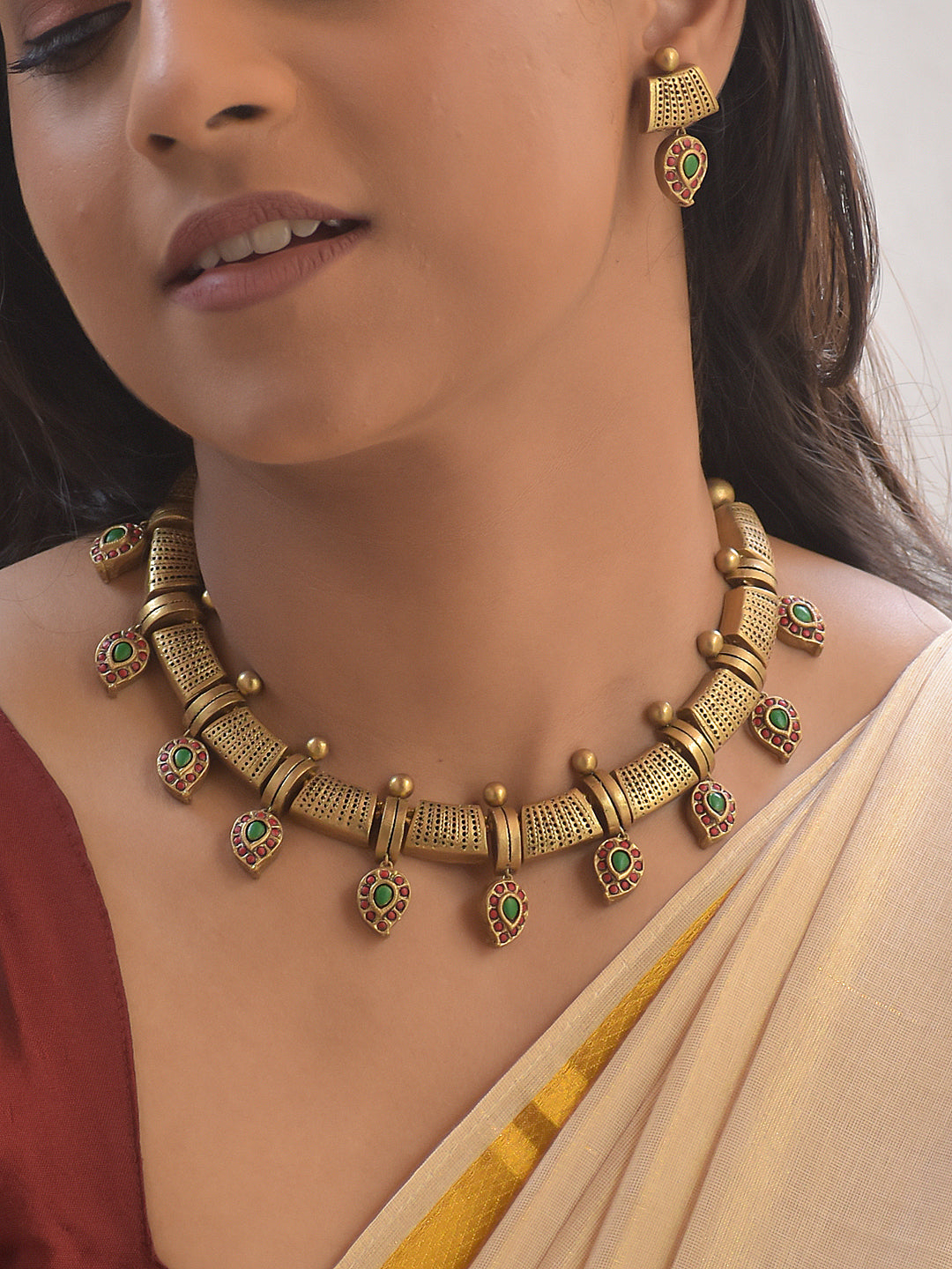Manjira – Handmade Terracotta Cylindrical Pattern Necklace Set with Green-Red Paisley Drops and Antique Gold Finish Earrings