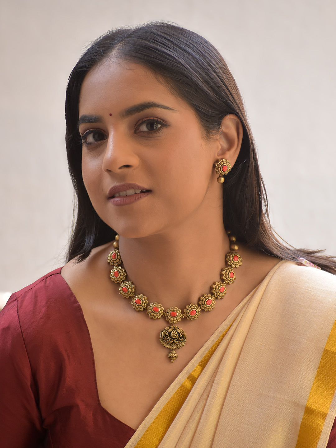 Kusumini – Handmade Terracotta Floral Necklace Set with Orange Color Coral-Toned Stones and Antique Gold Detailing