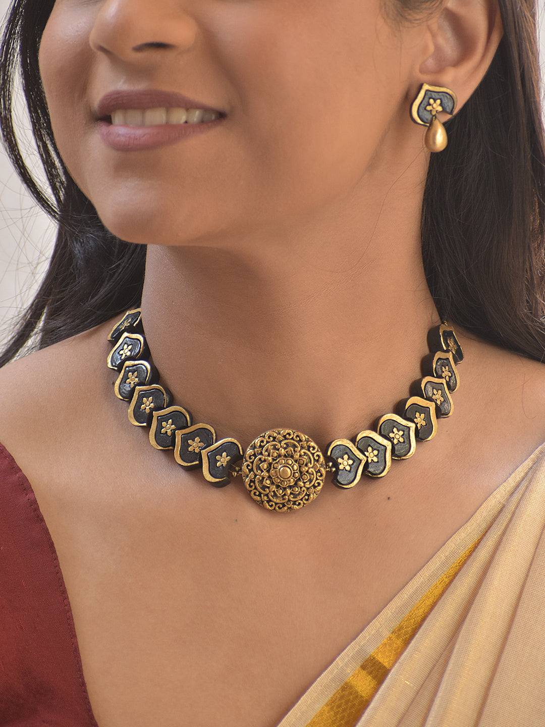 Hridaya – Handmade Terracotta Heart-Motif Choker Set with Antique Floral Centerpiece and Gold Drop Earrings