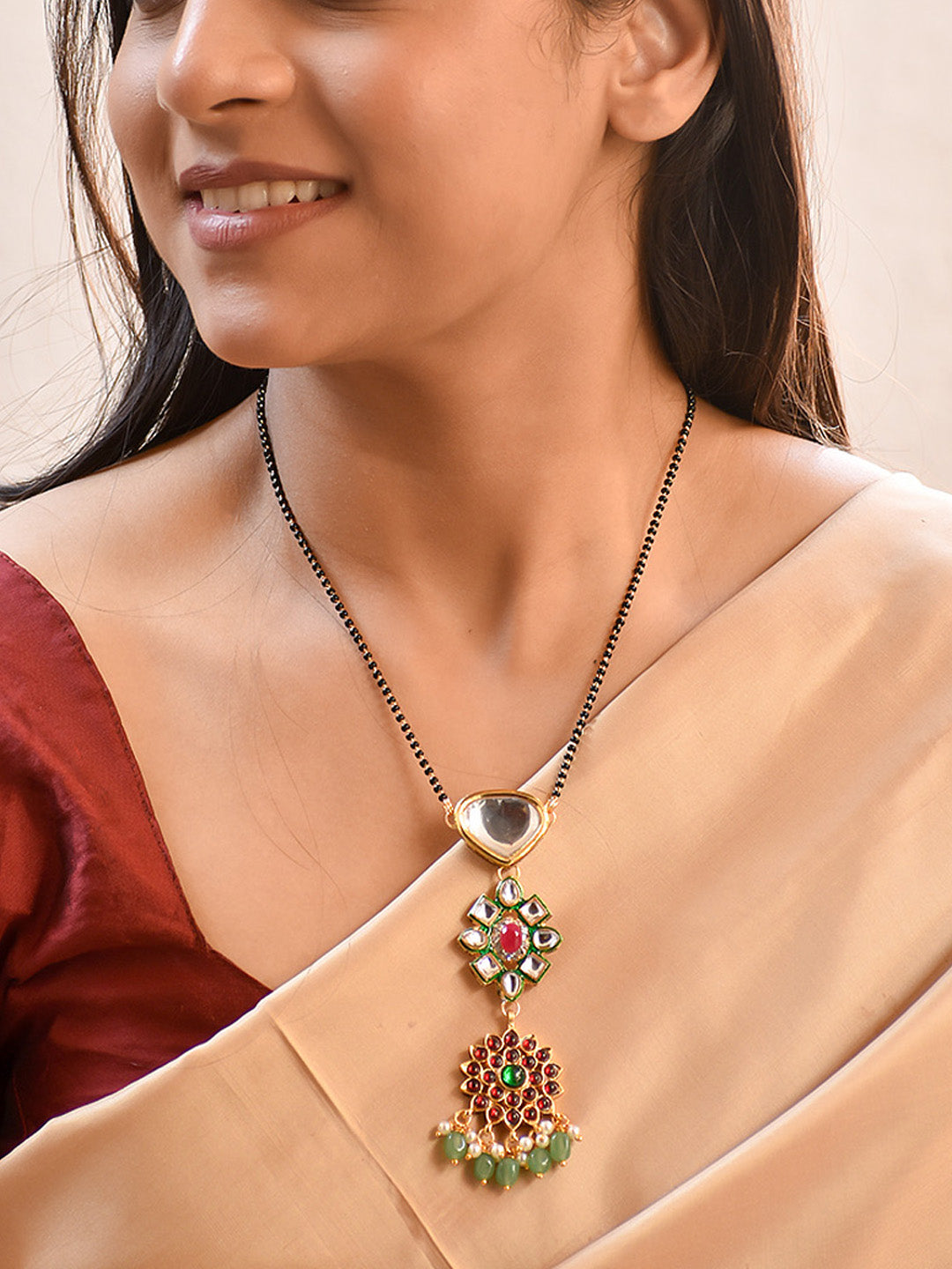 Premium Finish Mangalsutra in Handcrafted Kundan Stone Pendant & Kemp Floral Pendant in Green Beads