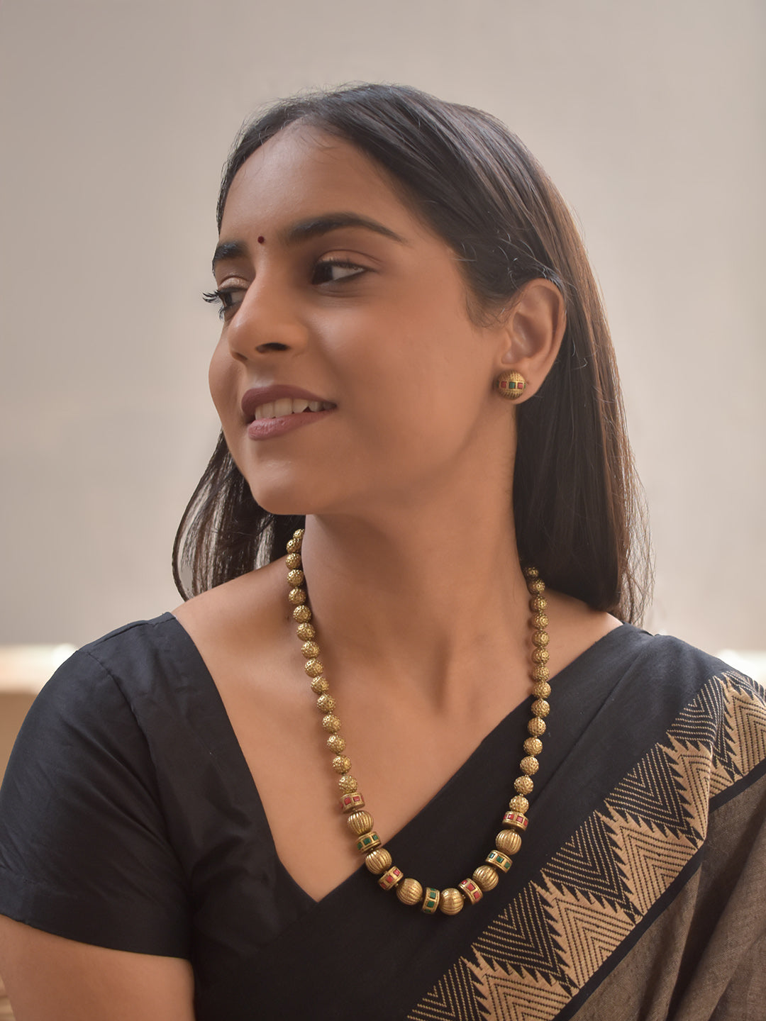 Pranitha – Terracotta Antique Gold Beaded Necklace Set with Red–Green Checkered Accents