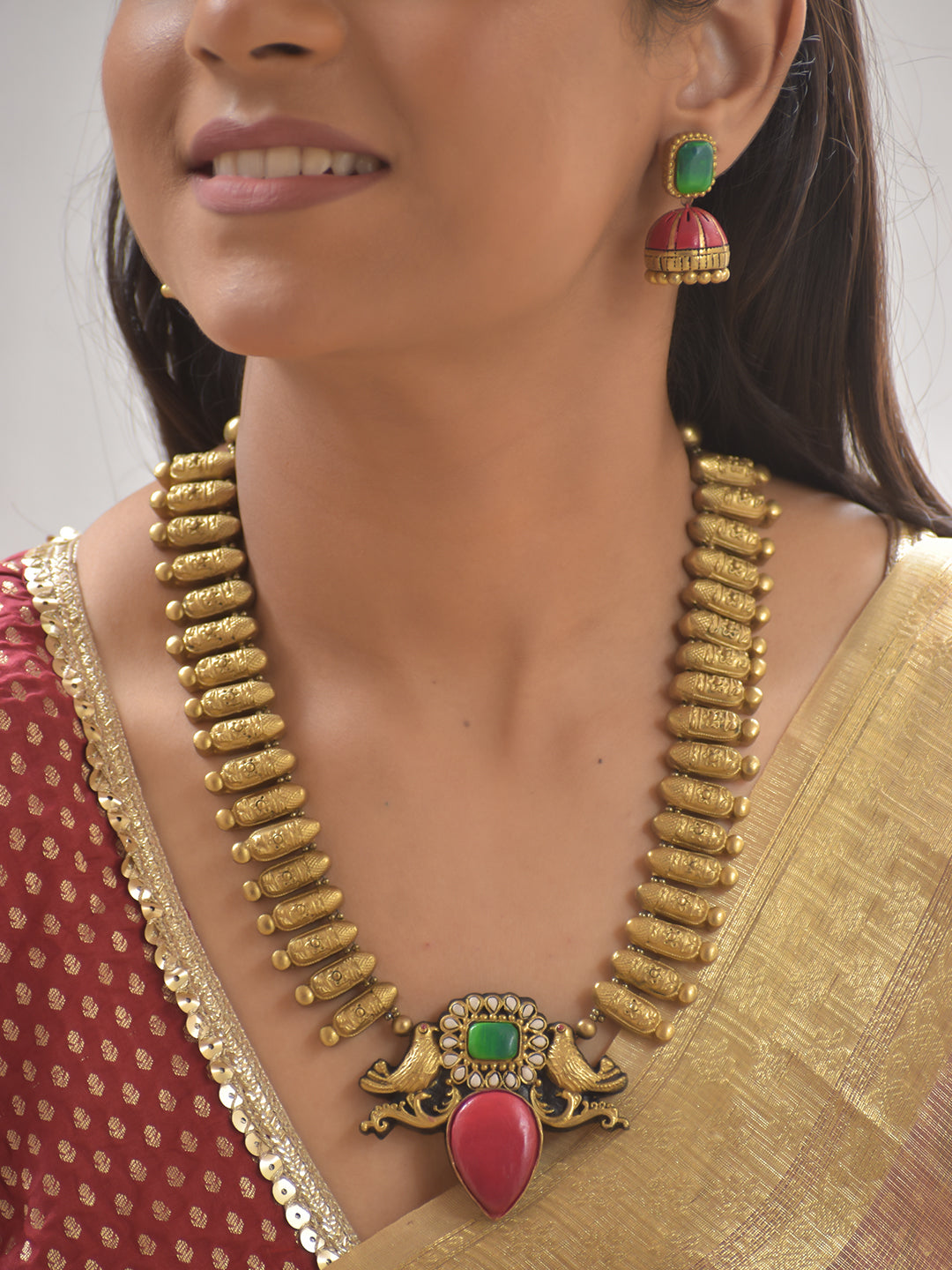 Terracotta Twin-Peacock Pendant Necklace with Pink-Green Stone Design With Jhumkas