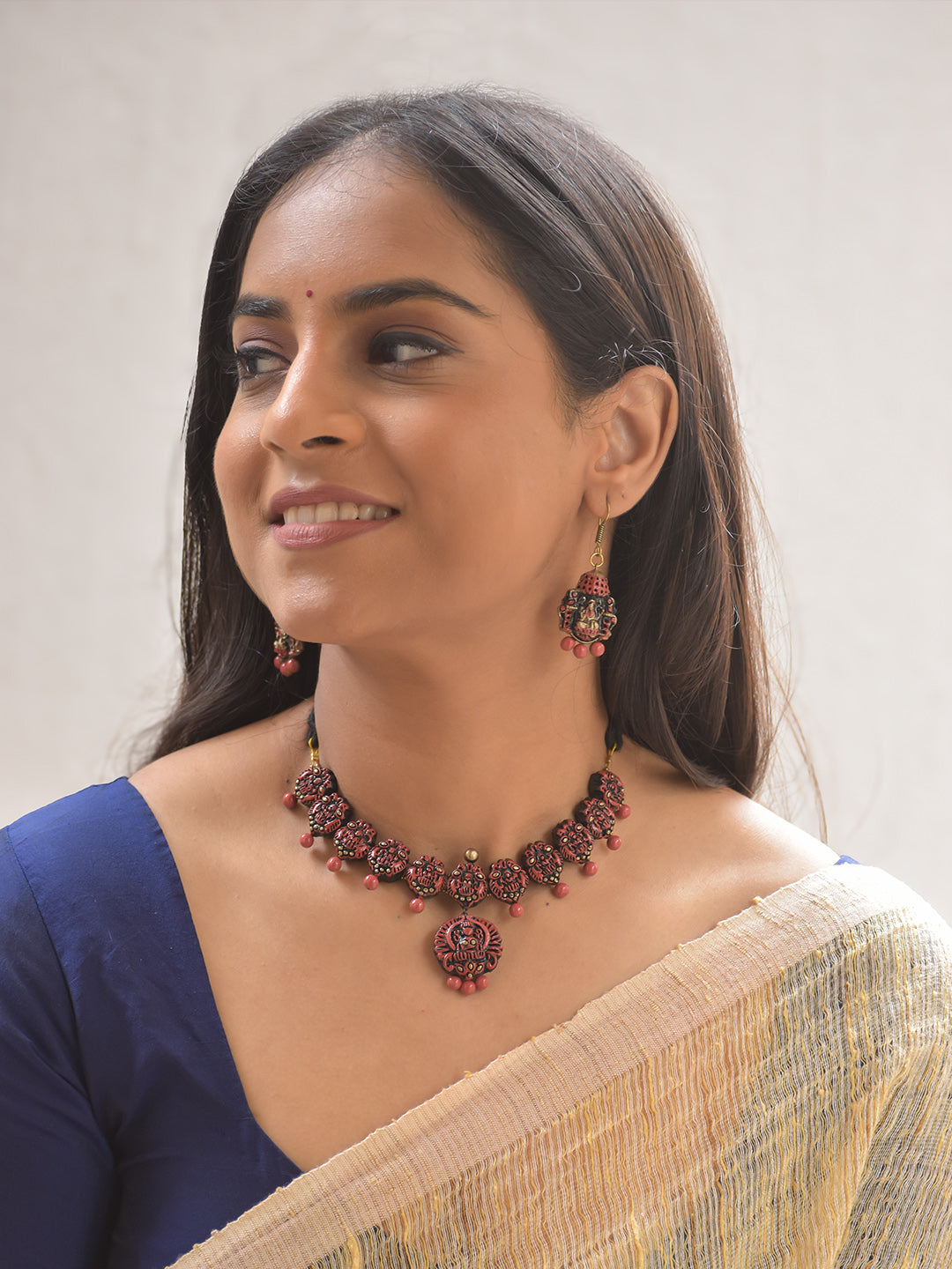 Terracotta Temple Deity Lakshmi Motif Necklace in Red Color with Bead Drops With Hanging Earrings