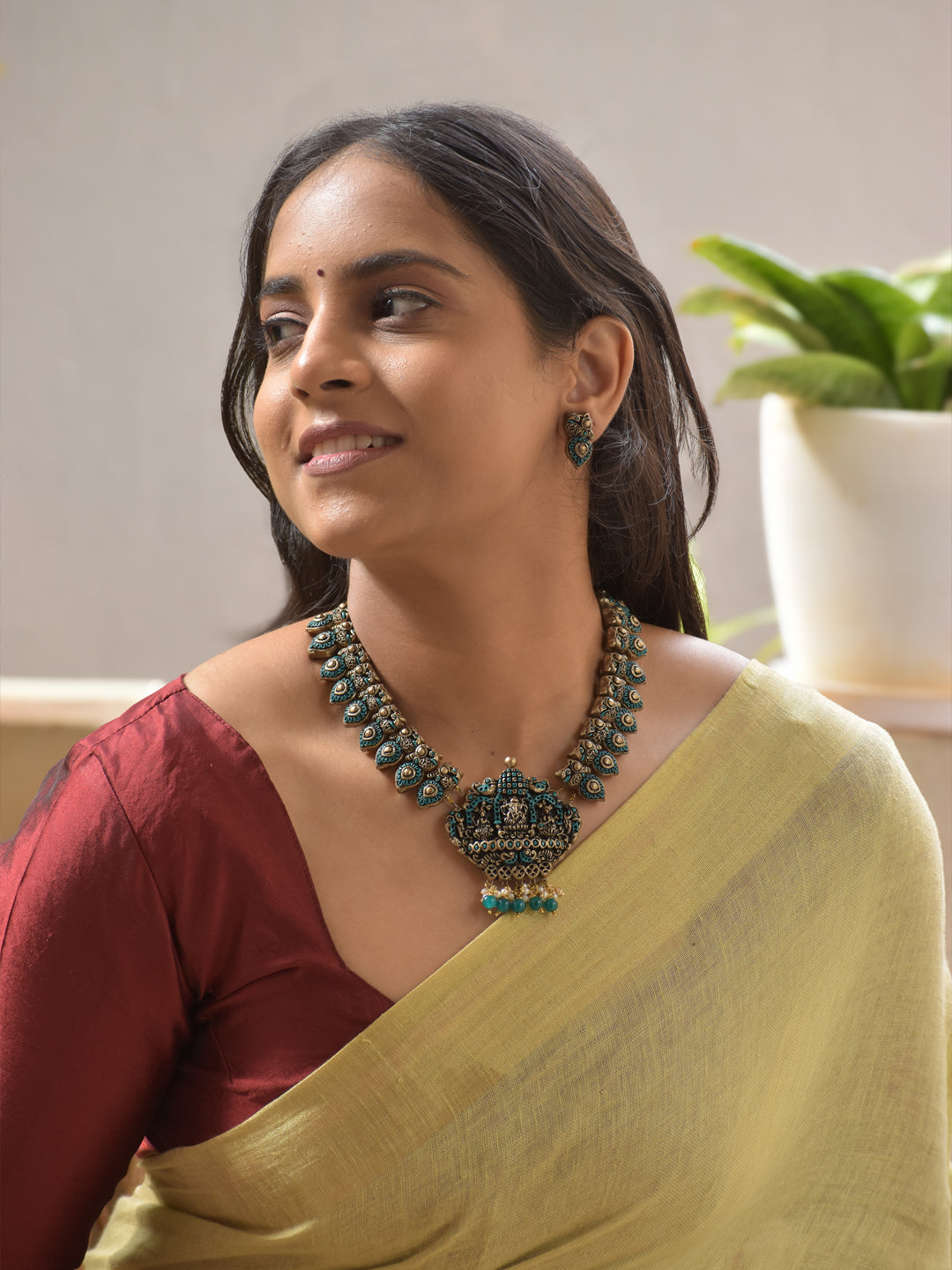 Antique Gold Terracotta Ganesha Pendant Necklace with Peacock Feather Motifs Stud Earrings