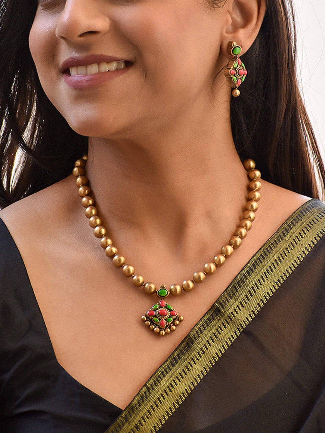 Beautifully Handcrafted Beaded Jewelry Set with Gold, Green, and Red Accents
