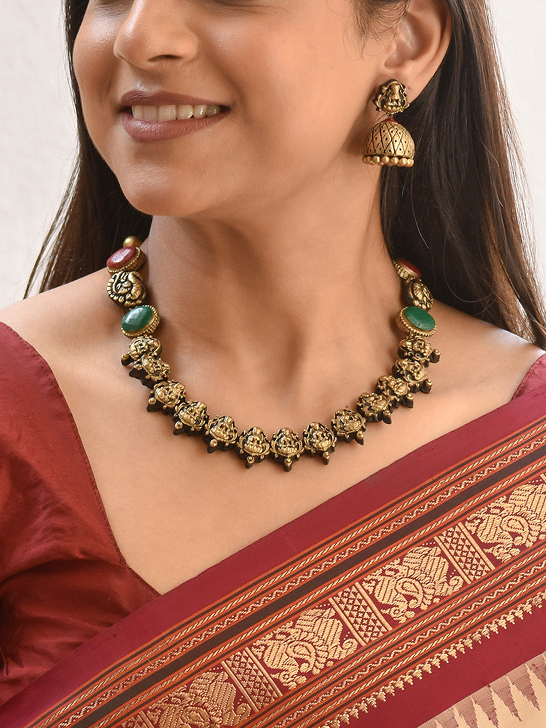 Handcrafted Lakshmi and Peacock Design Jewellery Set in Antique Gold with Red & Green Accents