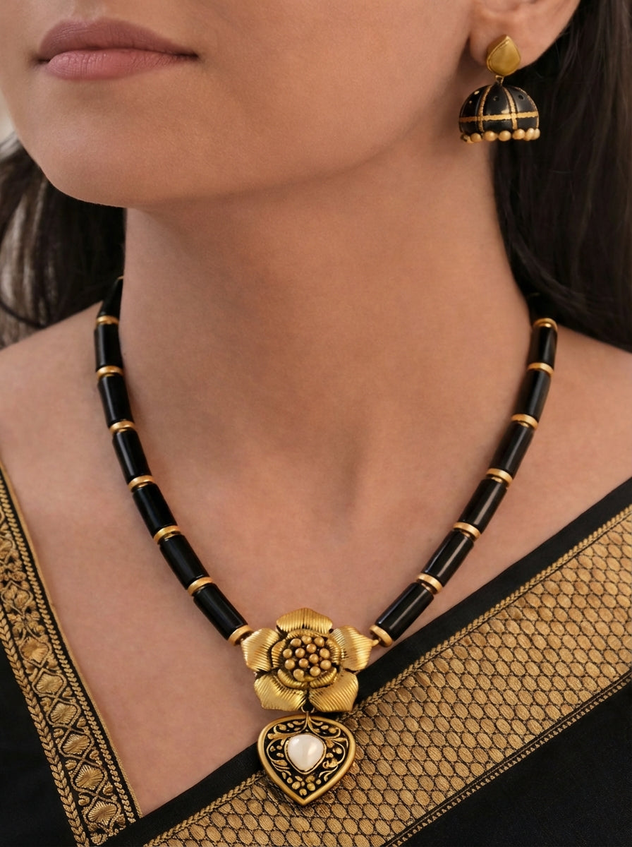 Kṛṣṇa Pushpa Lata — Golden Blossom Charm Black and Gold Terracotta Necklace Set With Jhumkas