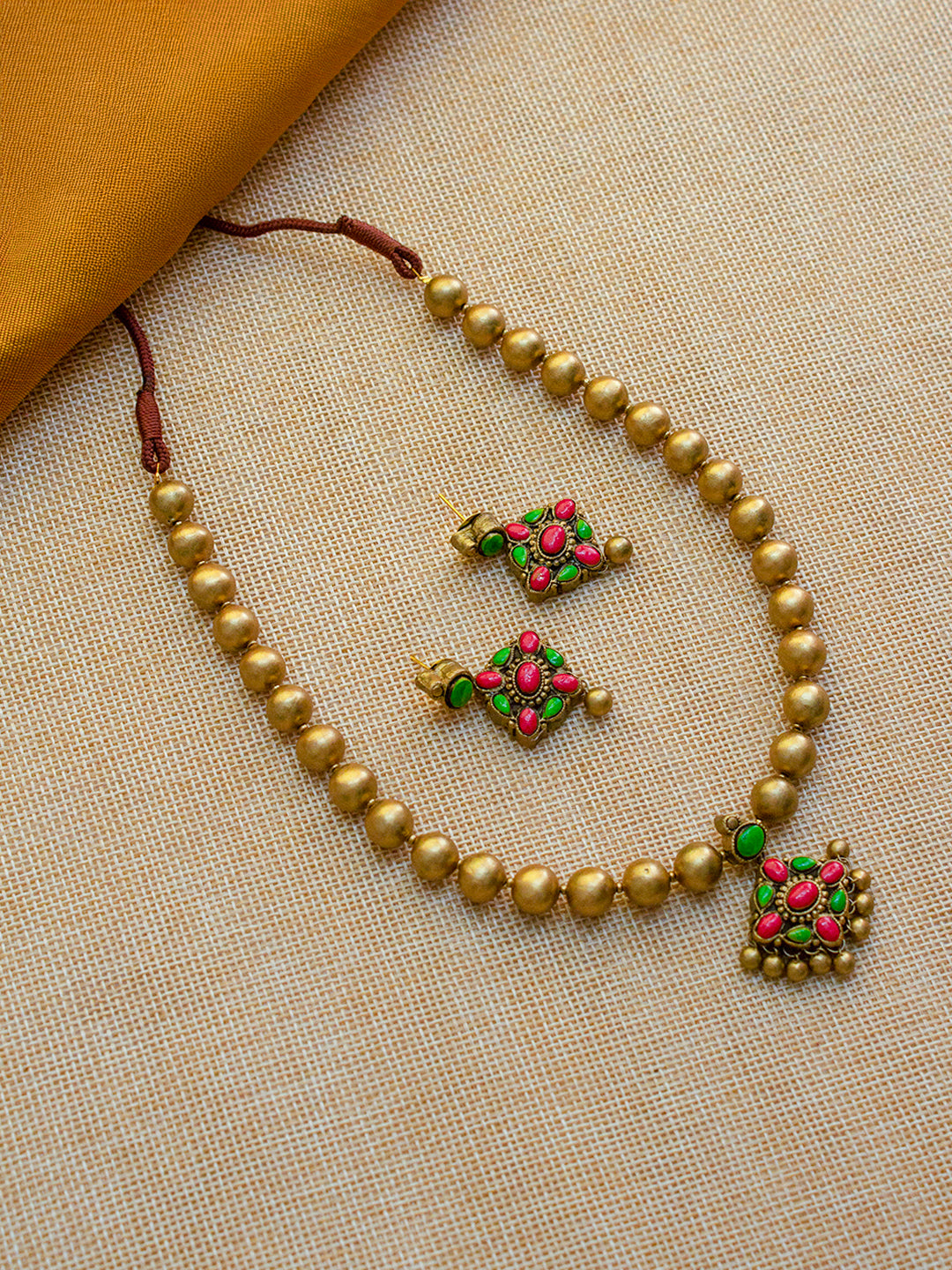 Beautifully Handcrafted Beaded Jewelry Set with Gold, Green, and Red Accents