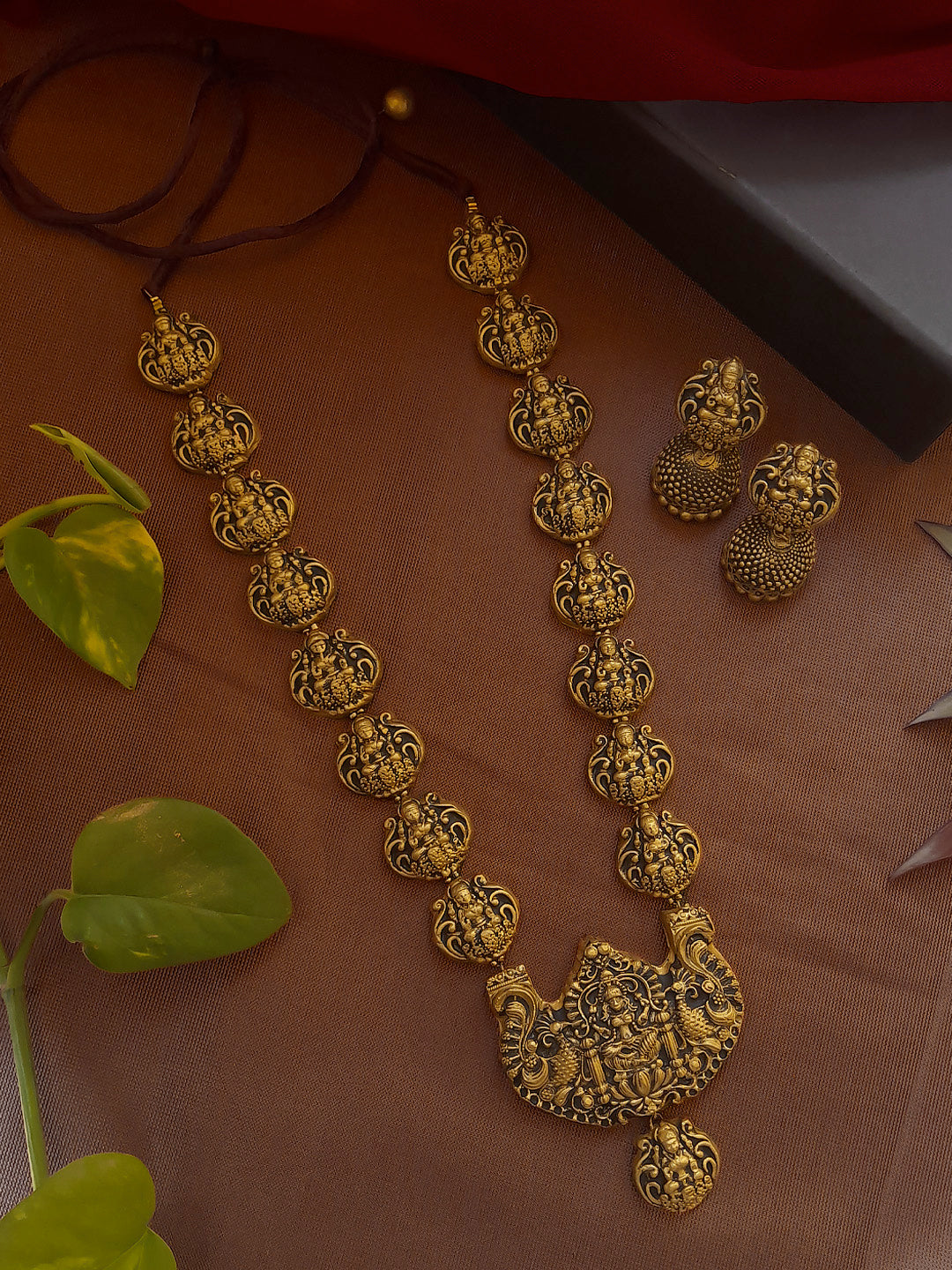 Antique Gold Toned lakshmi Design Pendant With Lakshmi Motifs