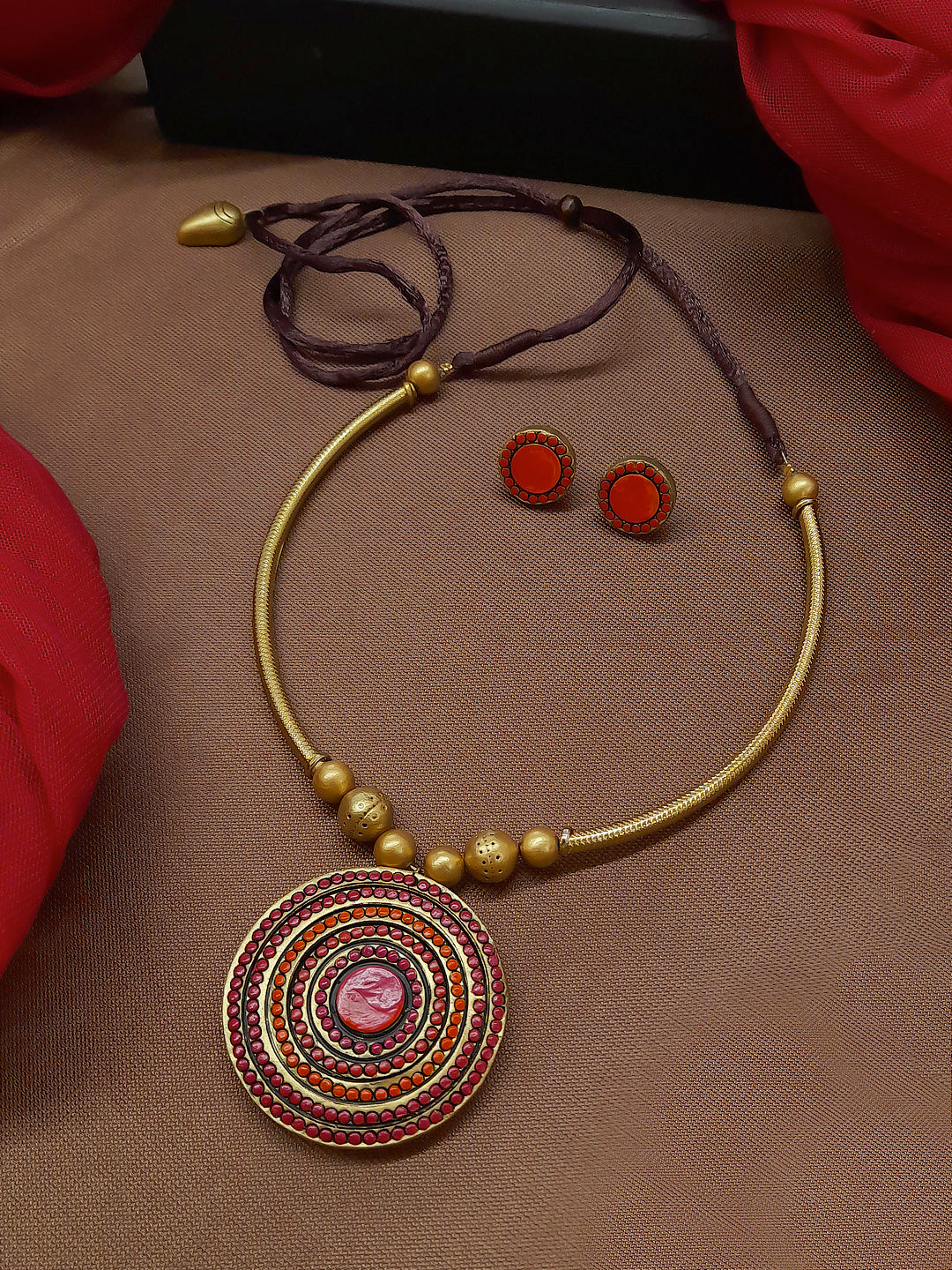 Antique Gold Toned Circular Shape Pendant Red And Pink Color Terracotta Choker Necklace Set