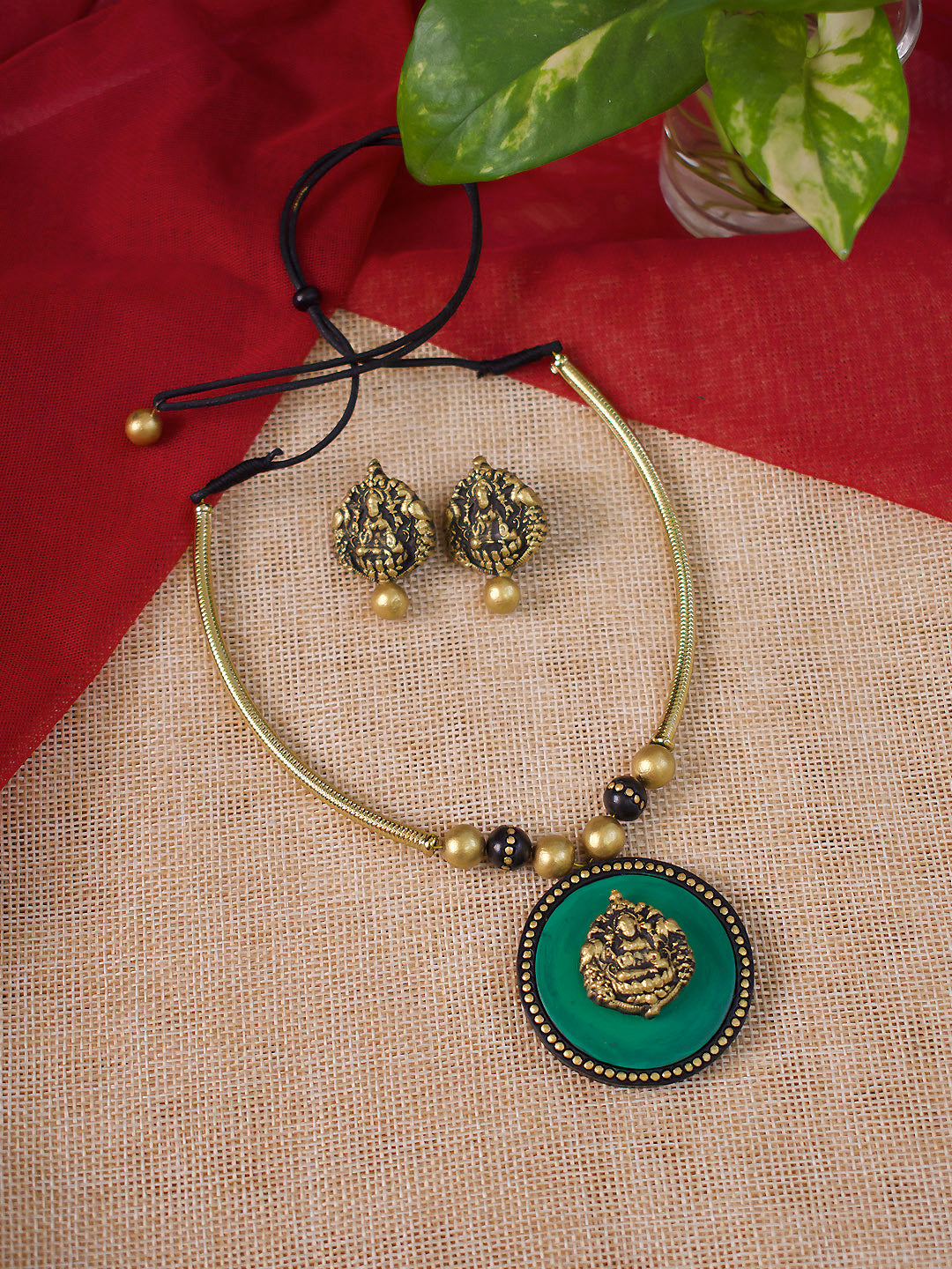 Antique Gold Toned Circular Shape Ganesha Design Pendant Green And Black Color Terracotta Choker Necklace Set