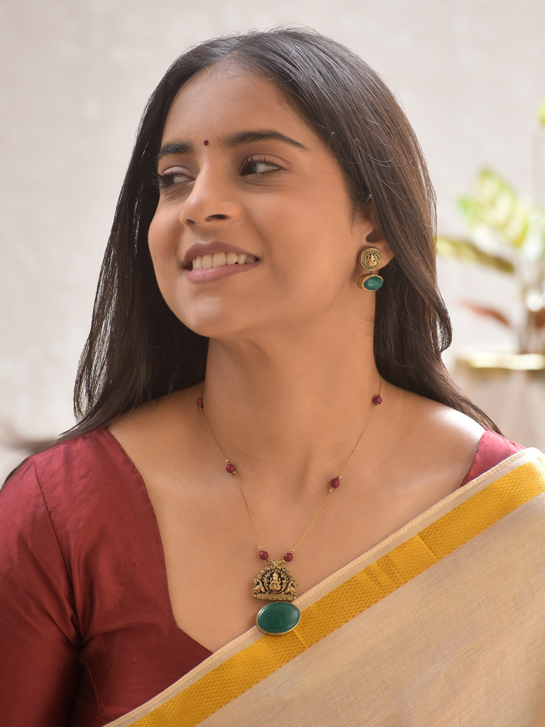 Terracotta Lakshmi Temple Pendant Necklace Set with Red Beads and Green Stone Highlights