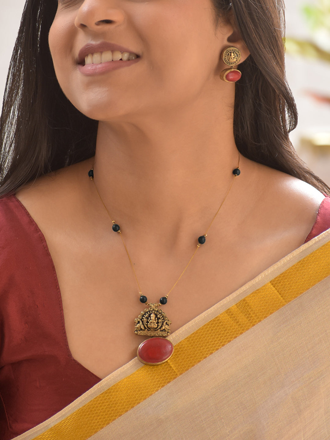 Terracotta Lakshmi Temple Pendant Necklace Set with Black Beads and Ruby Accents