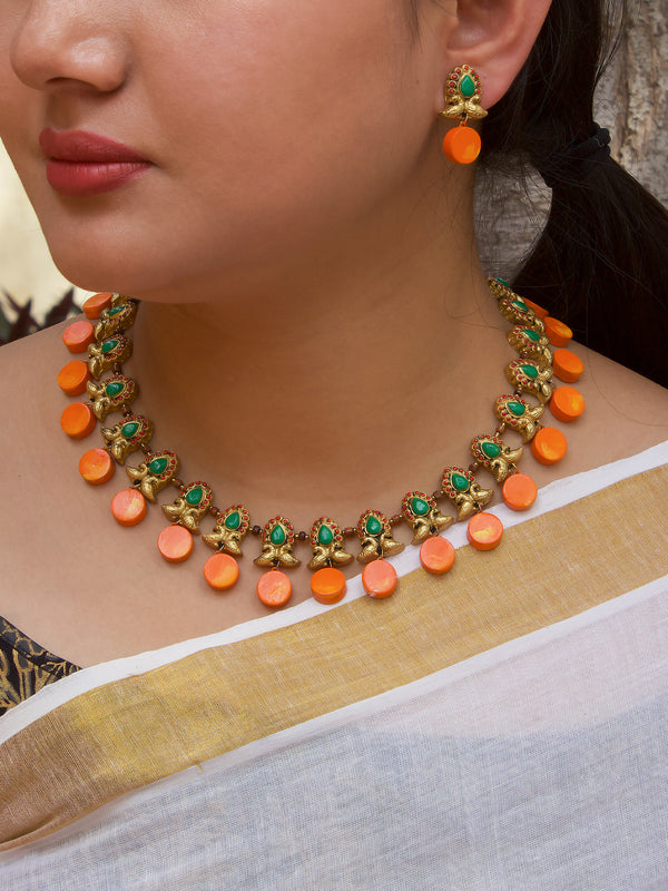 Antique Gold Toned Circular Shape Peacock Design Motifs Red And Green Color Terracotta Choker Necklace Set