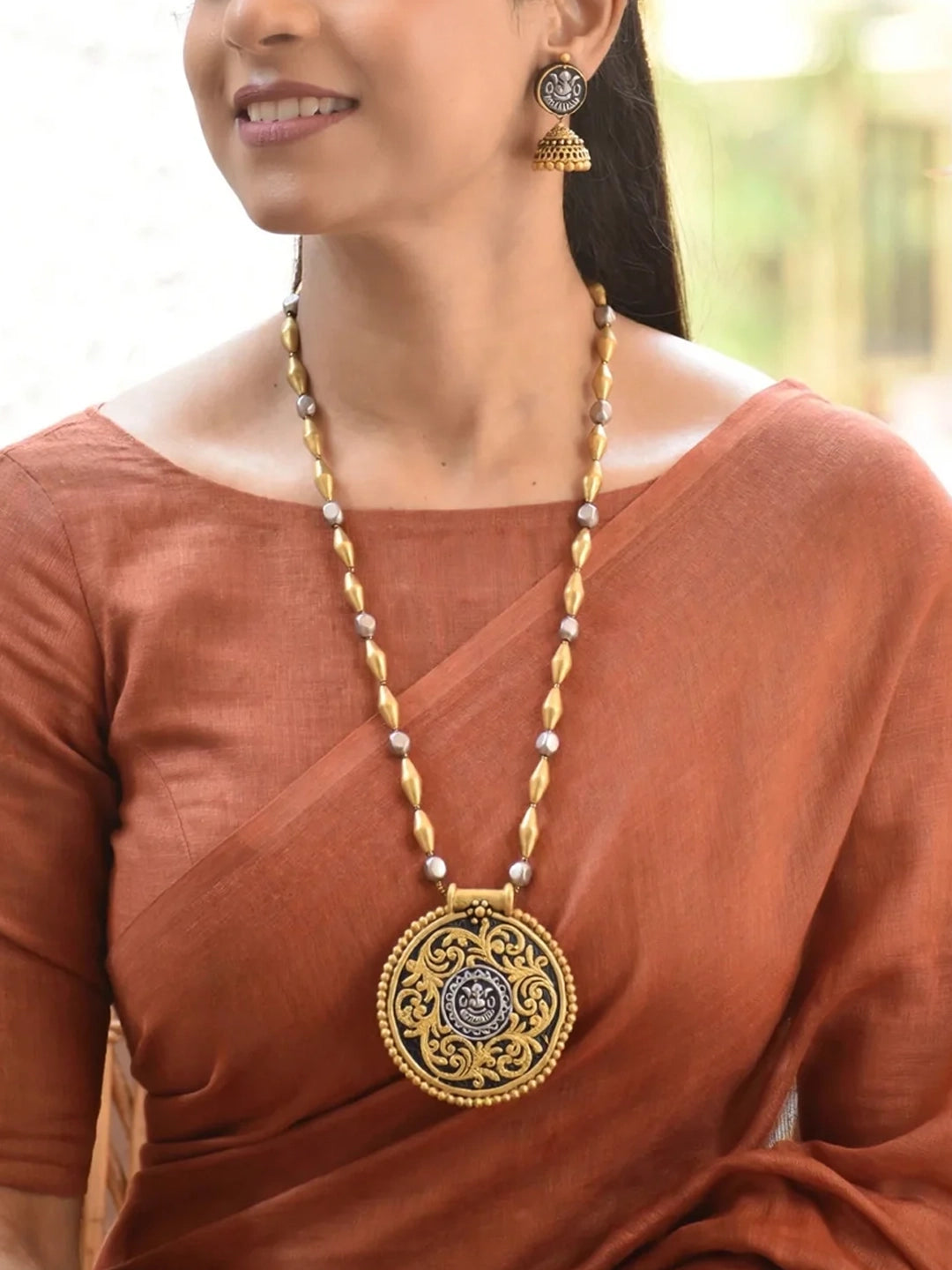 Handmade Terracotta Dual-Tone Round Ganesha Design Pendant Necklace with Antique Jhumka Earrings
