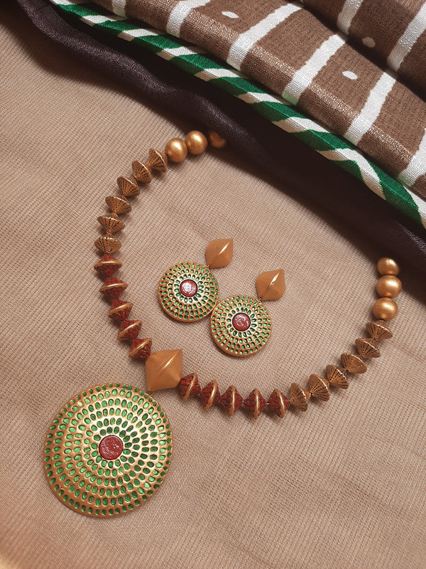 Antique Gold Toned Circular Shape Pendant Brown And Green Color Terracotta Choker Necklace Set