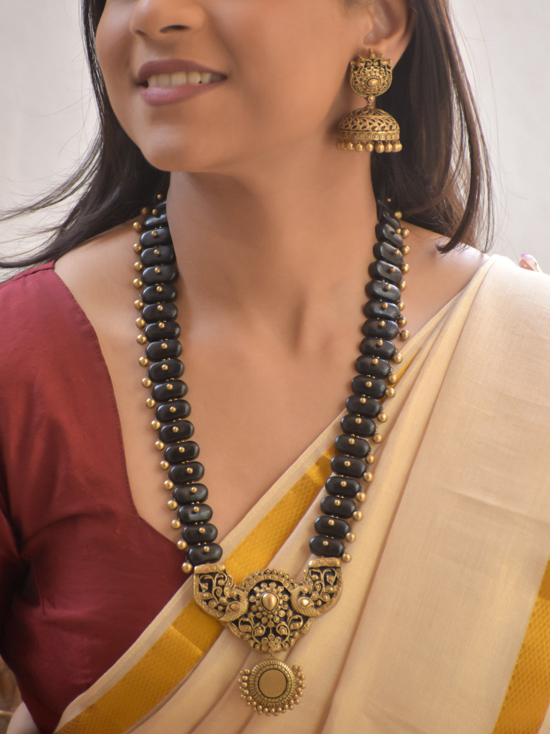 Shringarika – Handmade Terracotta Antique Black–Gold Necklace Set with Intricate Filigree Pendant and Jhumka Earrings
