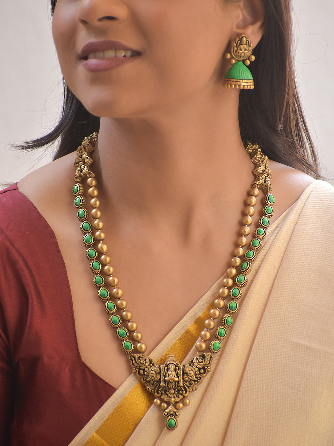 Harinishwari – Terracotta Lakshmi Pendant Long Necklace Set with Green Stone Accents