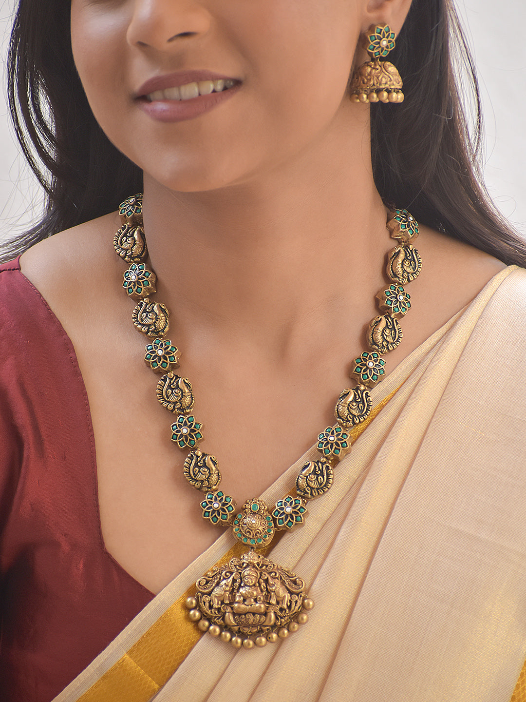 Srilakshya – Handmade Terracotta Lakshmi Pendant Necklace Set with Peacock Motifs and Teal Floral Accents