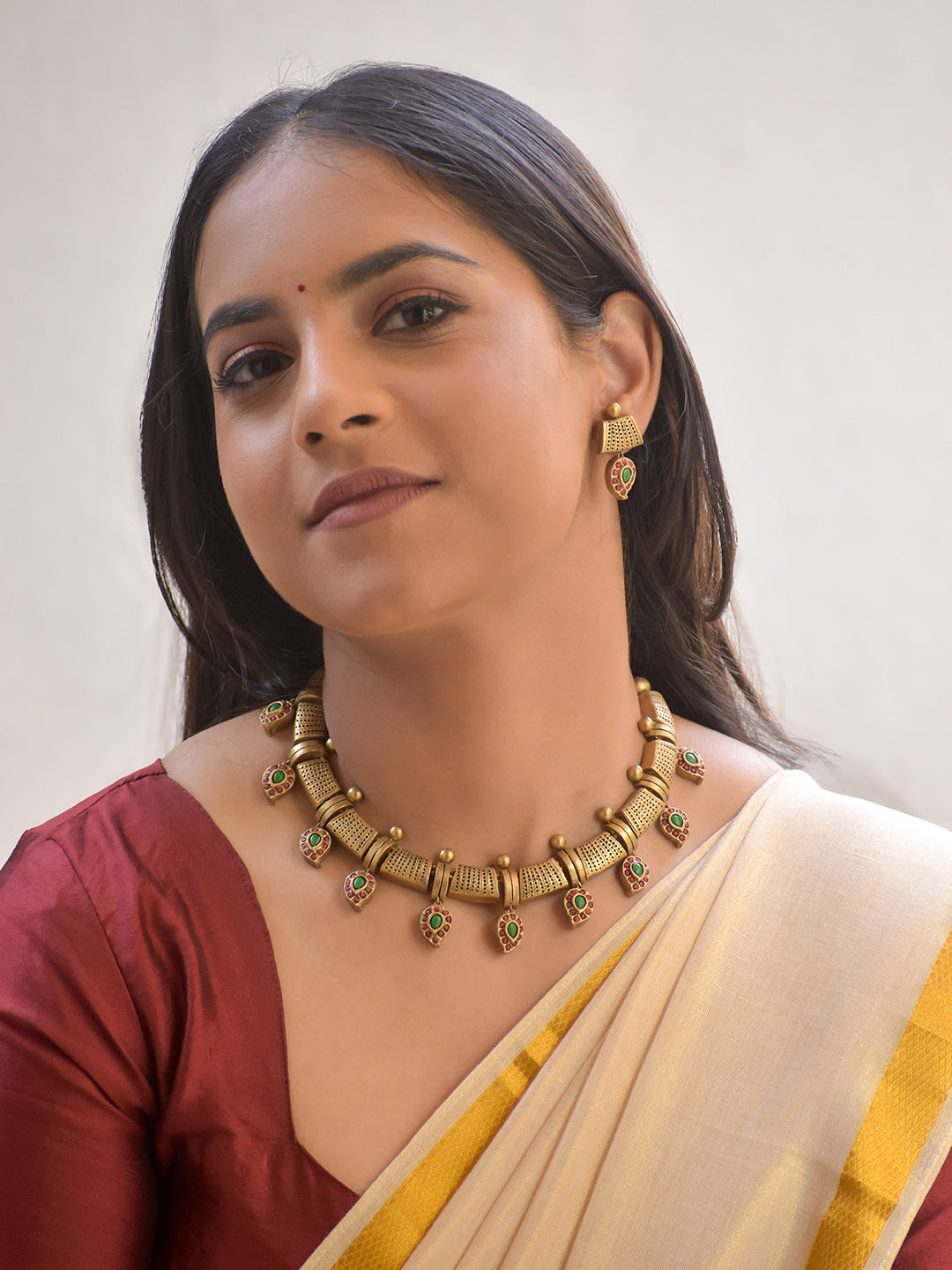 Manjira – Handmade Terracotta Cylindrical Pattern Necklace Set with Green-Red Paisley Drops and Antique Gold Finish Earrings