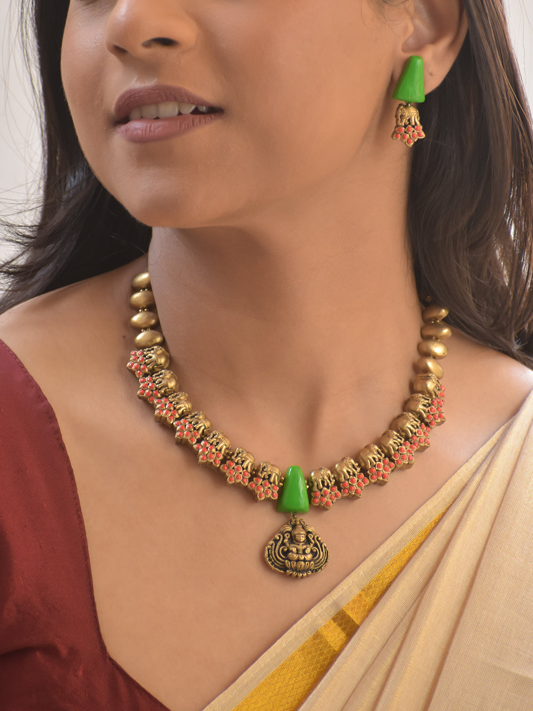 Haram – Terracotta Antique Gold Elephant Motif Necklace with Green Cone Beads & Goddess Pendant