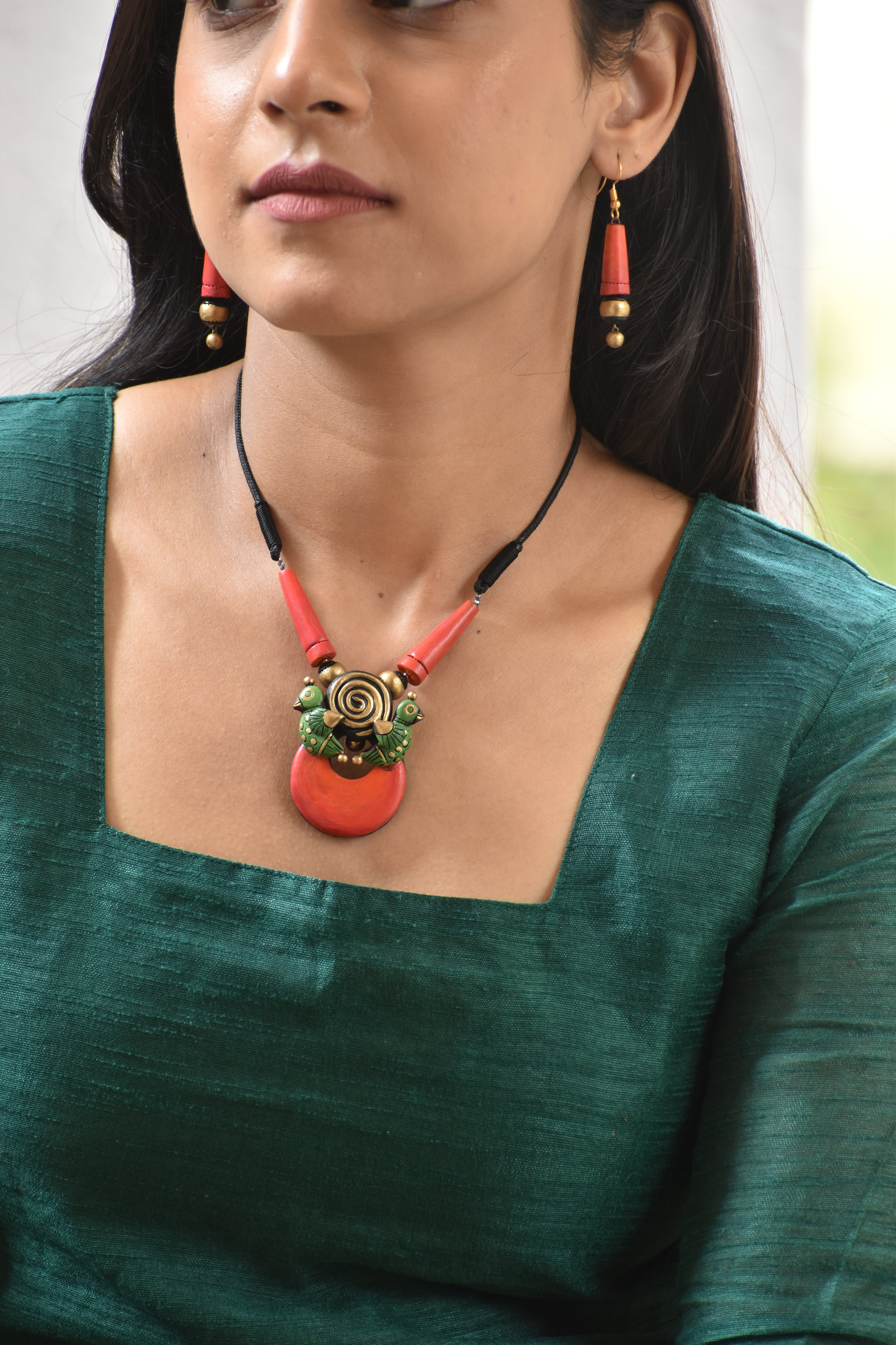 Terracotta Bold Pendant Necklace with Tribal Bird Details