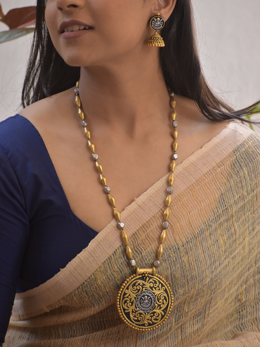 Handmade Terracotta Dual-Tone Round Ganesha Design Pendant Necklace with Antique Jhumka Earrings