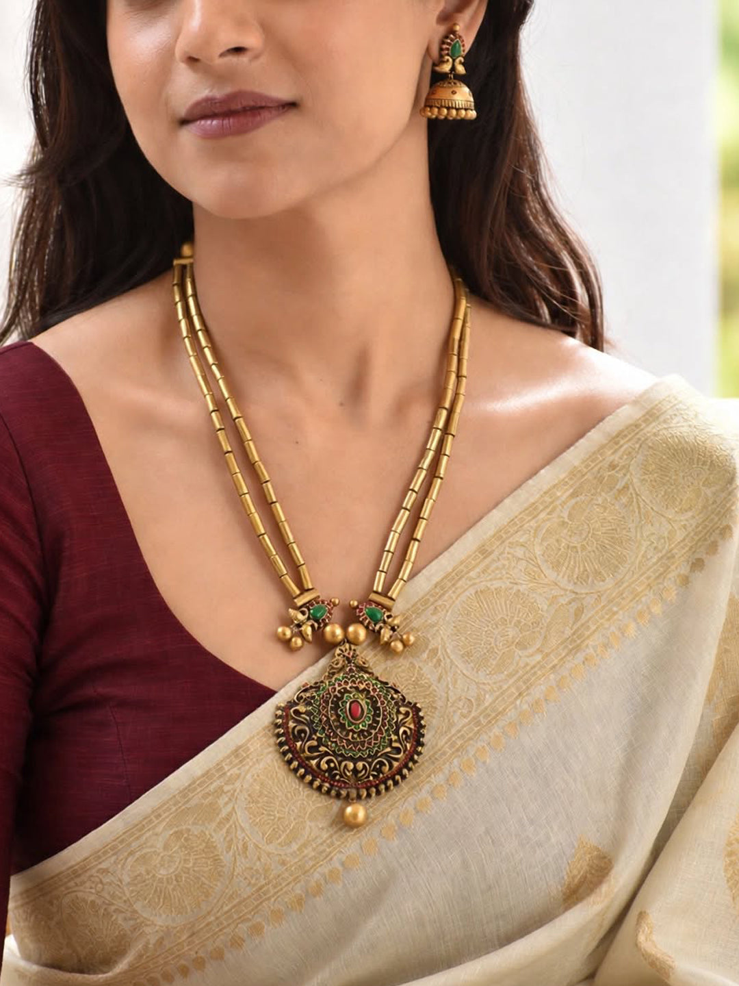 Dvimayura — Antique Gold Toned Peacock Design Pendant Two Layered Cylindrical Shape Beads Terracotta Necklace Set