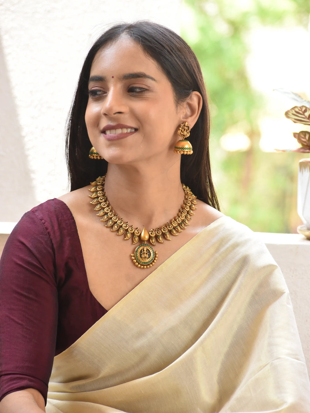 Antique Gold Toned Lakshmi Design Pendant With Peacock Design Motifs Terracotta Necklace Set