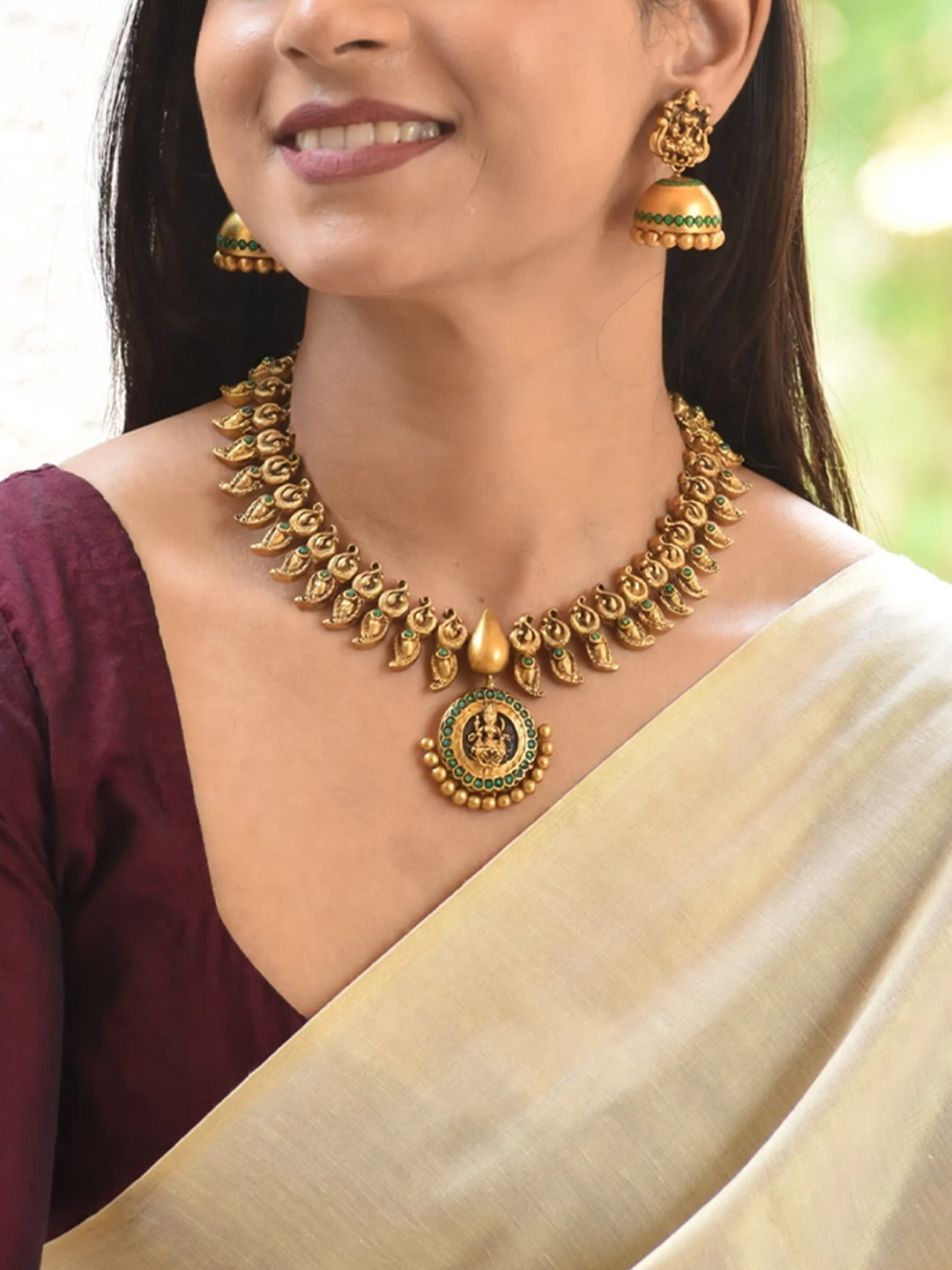 Antique Gold Toned Lakshmi Design Pendant With Peacock Design Motifs Terracotta Necklace Set