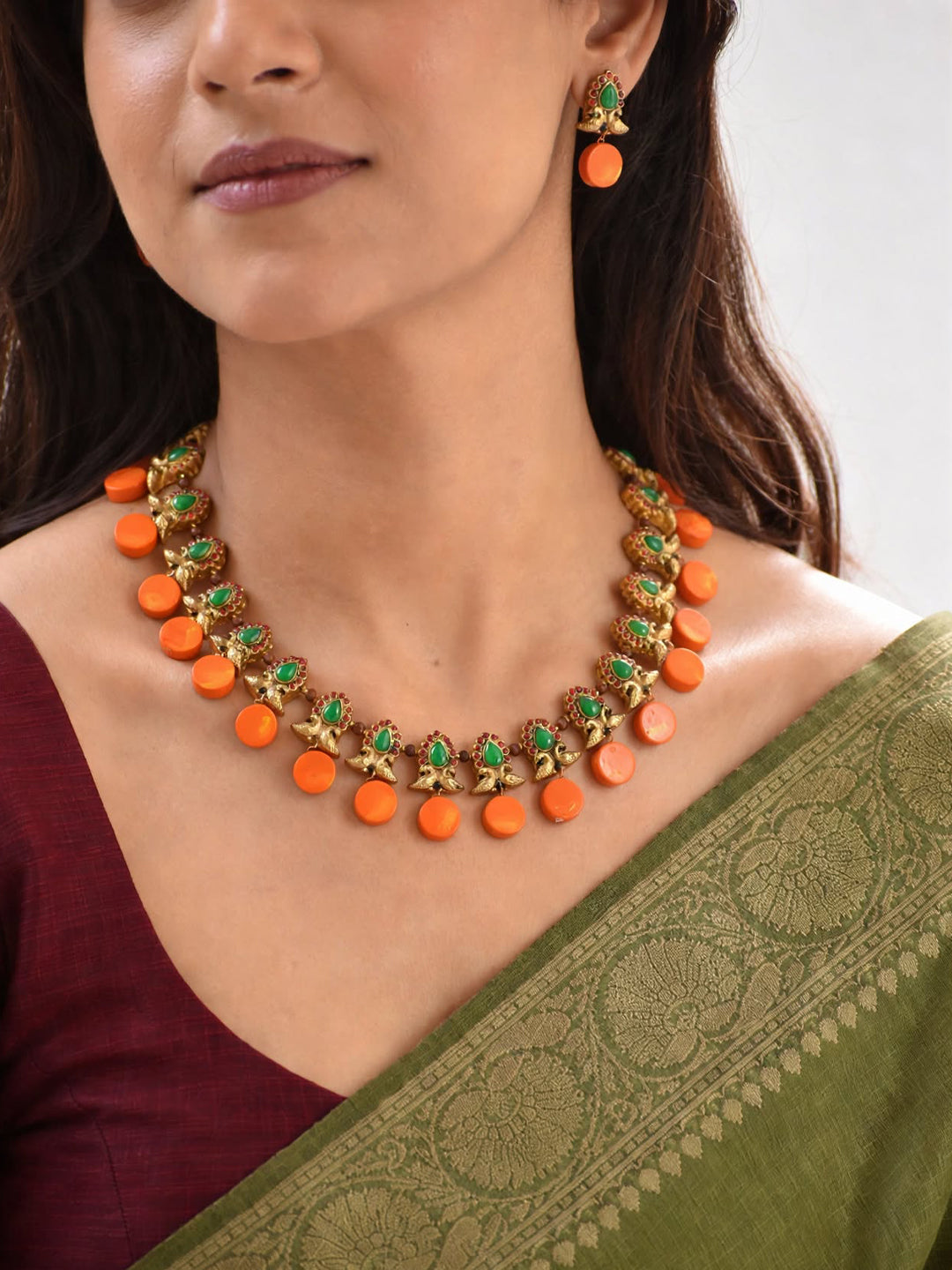 Antique Gold Toned Circular Shape Peacock Design Motifs Red And Green Color Terracotta Choker Necklace Set