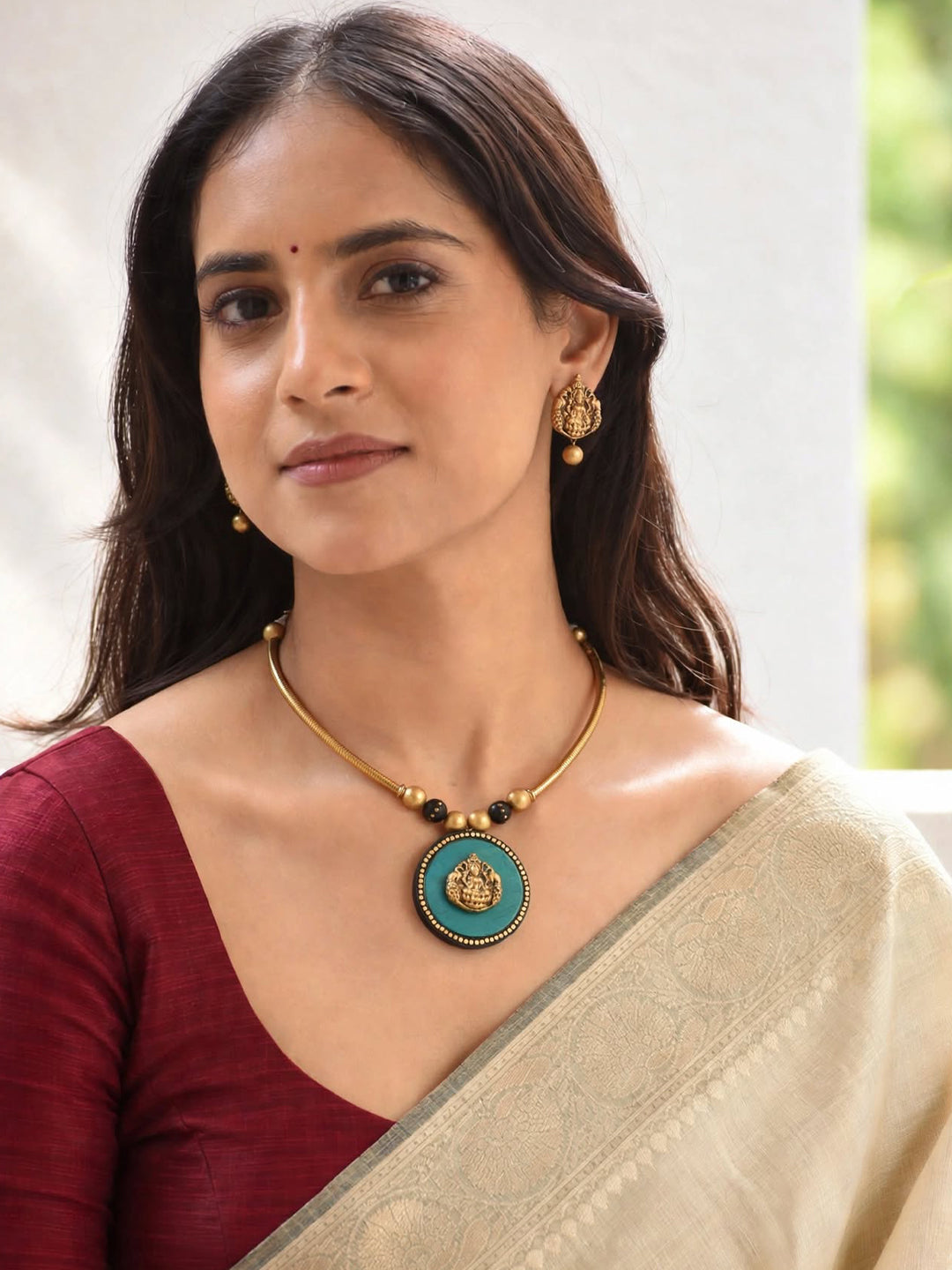 Antique Gold Toned Circular Shape Ganesha Design Pendant Green And Black Color Terracotta Choker Necklace Set