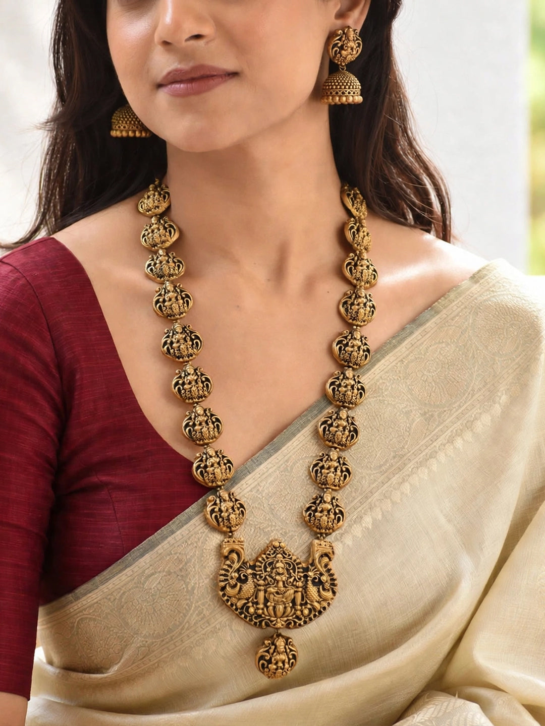 Antique Gold Toned lakshmi Design Pendant With Lakshmi Motifs Terracotta Choker Necklace Set