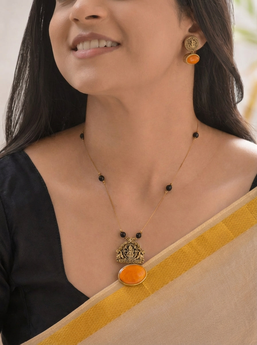 Parvathy — Terracotta Lakshmi Temple Pendant Necklace Set with Black Beads and Bright Orange Stone Highlights
