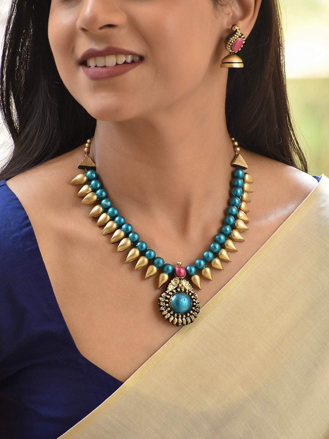 Terracotta Beaded Necklace with Spike Detailing and Statement Pendant