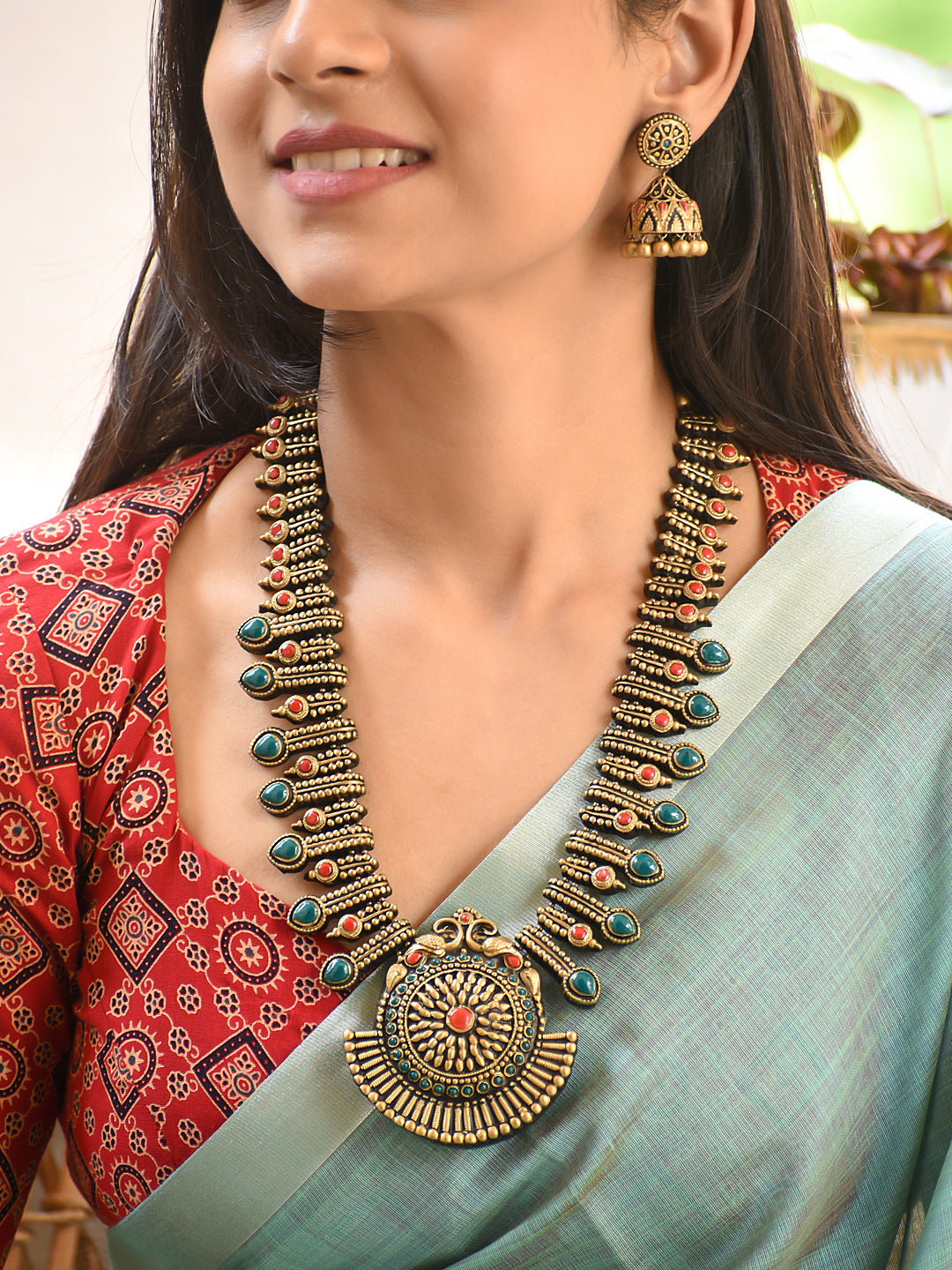 Terracotta Statement Necklace with Layered Motifs and Round Pendant